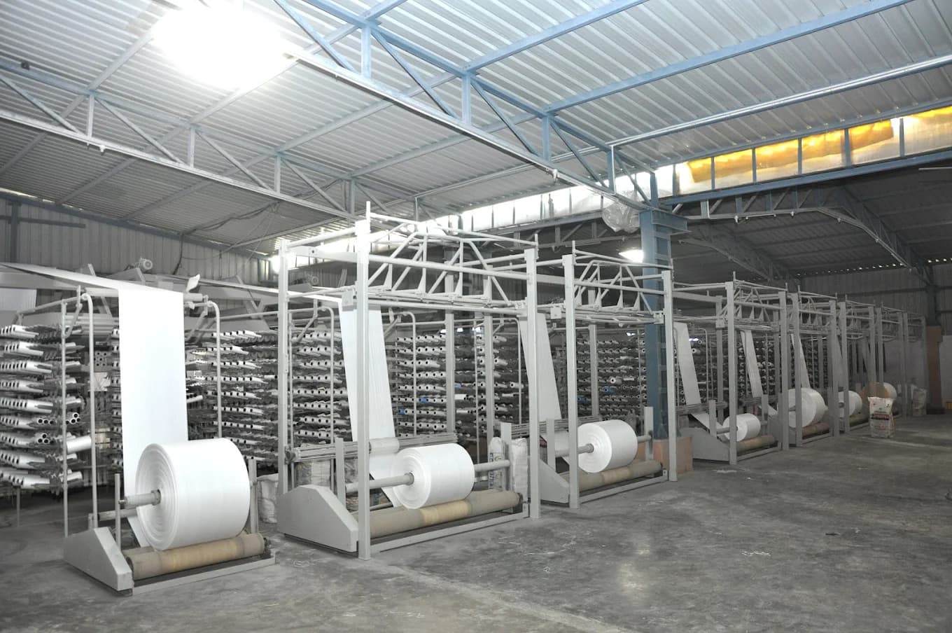 Industrial factory interior with PP woven rolls